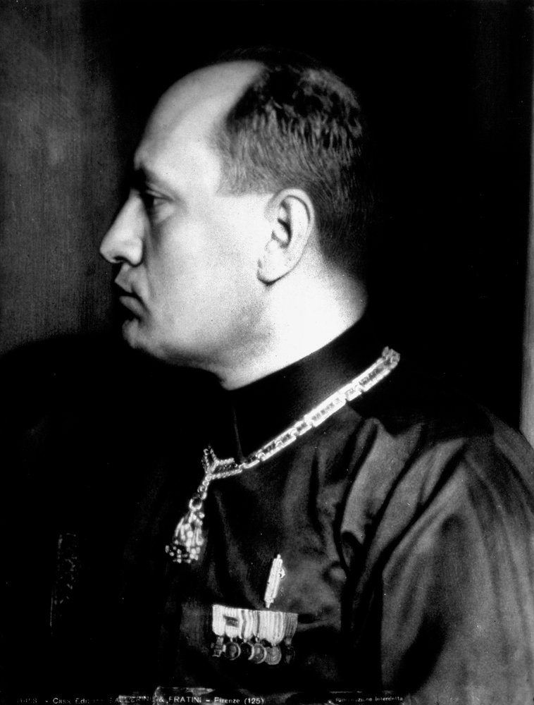Half-length portrait in profile of Benito Mussolini in black shirt and ...