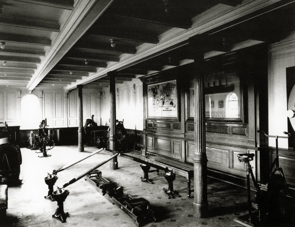 The onboard gym on the Titanic showing the rowing machines and exercise ...