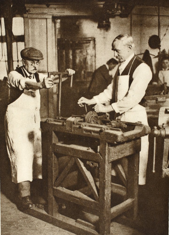 Two elderly locksmiths cutting key barrels, from Wonderful London ...