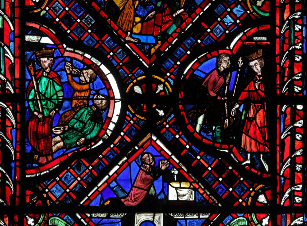 Window depicting scenes from the legend of St John, including the saint ...