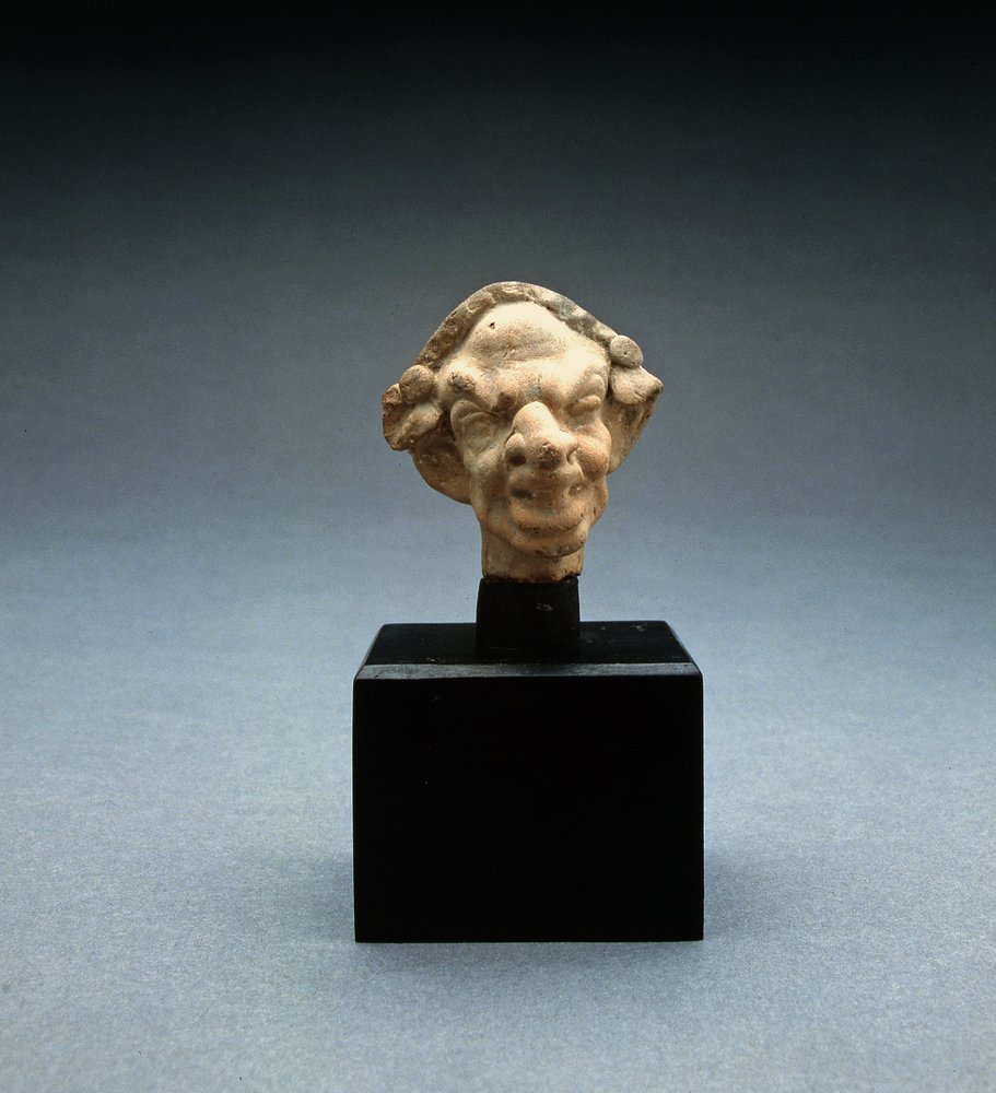 Grotesque Head of a Woman by Greek