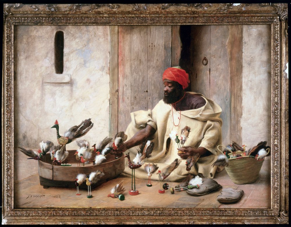A bird merchant in the street of Tangier in Morocco