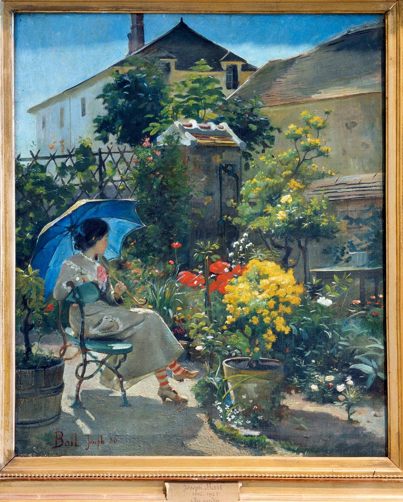 In the garden. A young woman with an umbrella, surrounded by flowers ...