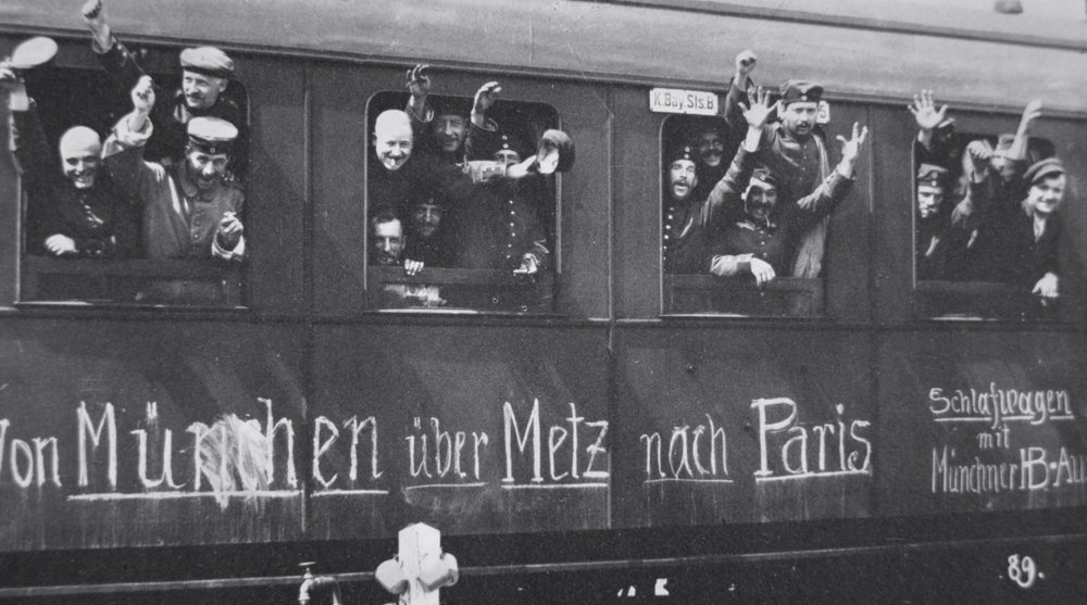 German troops in WWI leave for the front in a railway carriage with the message “From Munich via Metz to Paris”, September 1914 by Photographer German