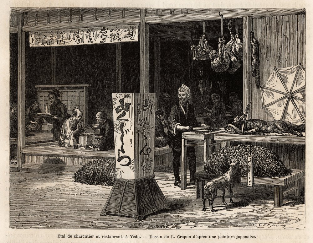Customers eat sitting on the stage of a restaurant and the neighbour of ...