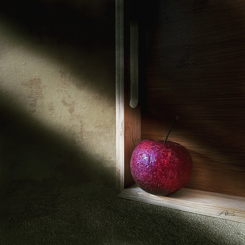 Red Apple In Shadow by Amal Ahmed