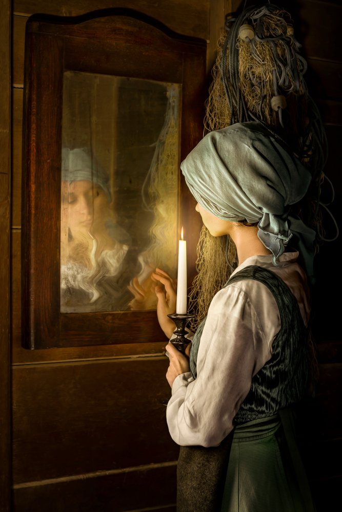 Woman Reflecting by Candlelight by Andrzej Lisowski