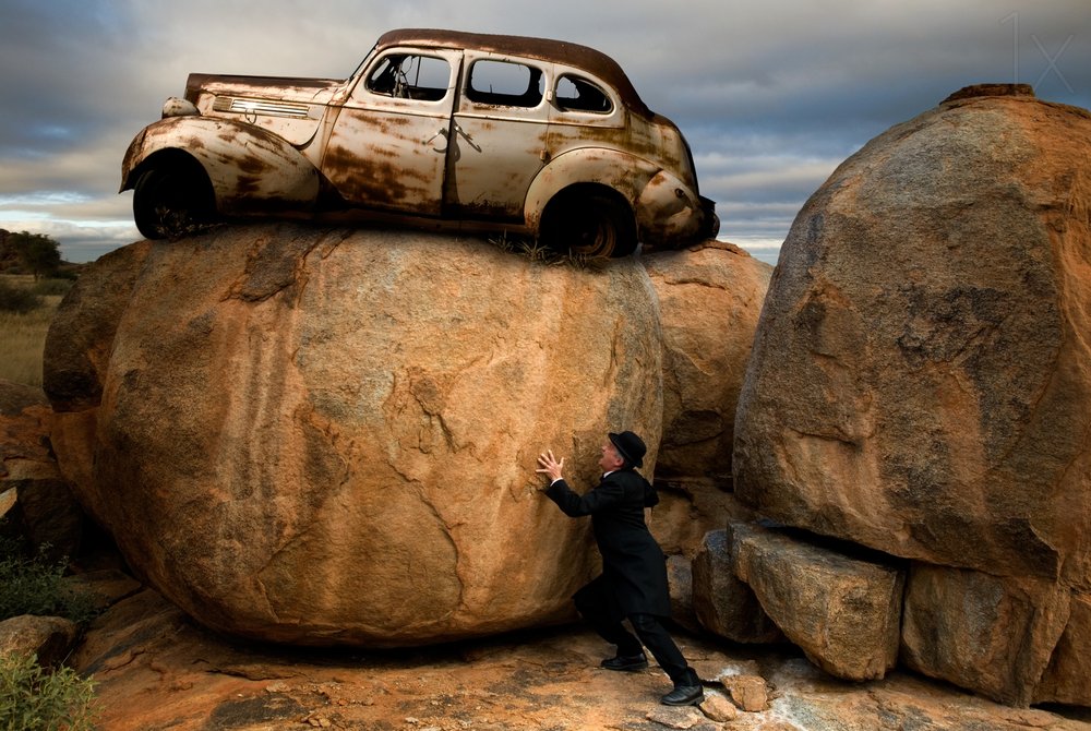 Man Pushing Car Boulder by Christine von Diepenbroek