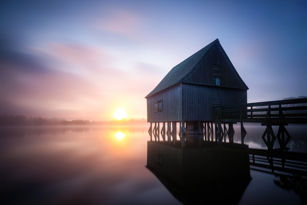 Misty Boathouse Sunrise by Christoph Schaarschmidt