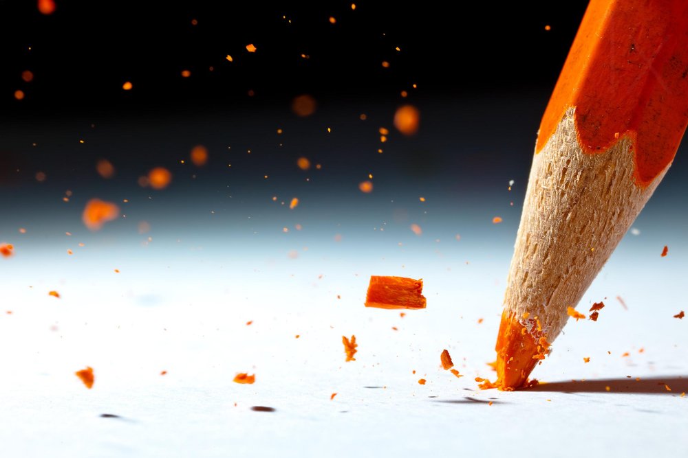 Orange Pencil Breaking by Christophe Kiciak
