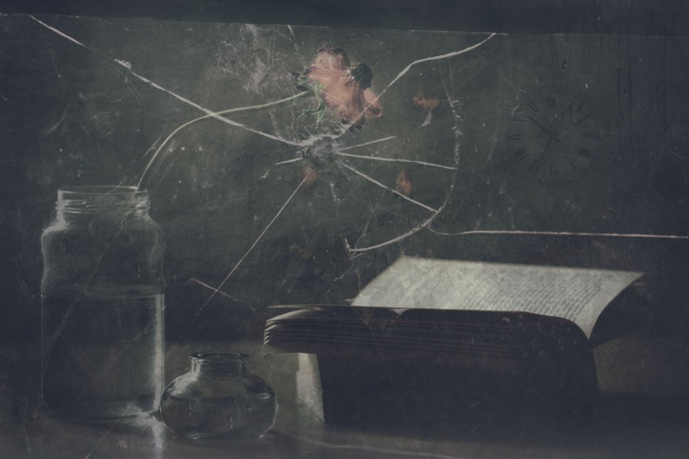 Cracked Glass and Old Book by Delphine Devos