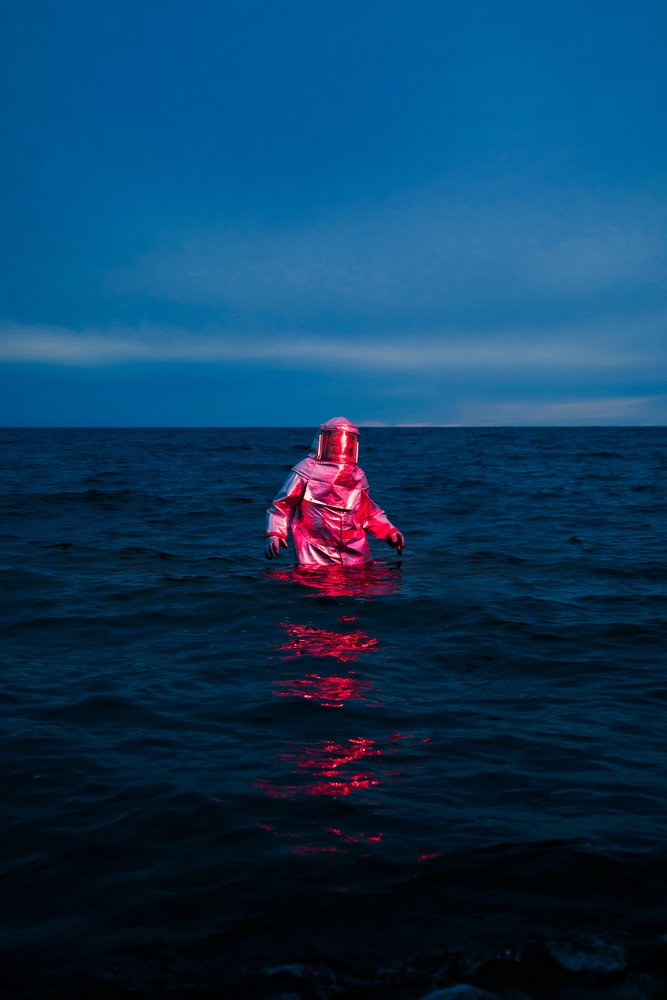 Red Suit Blue Sea by Samantha Hearn