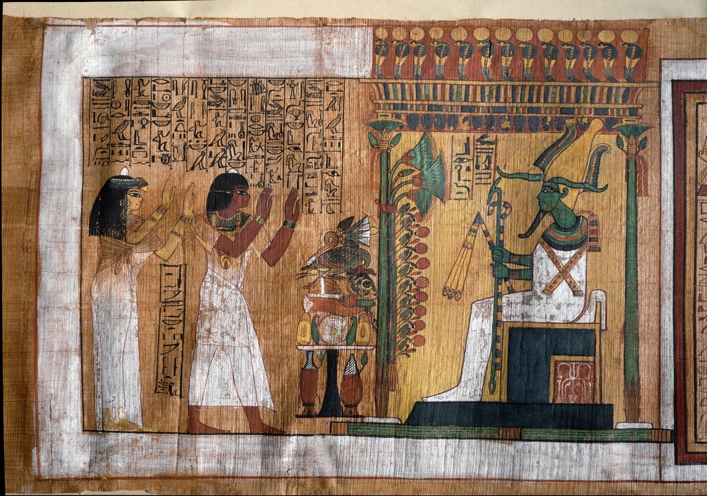 The deceased Kha and his wife Merit worship Osiris, lord of the