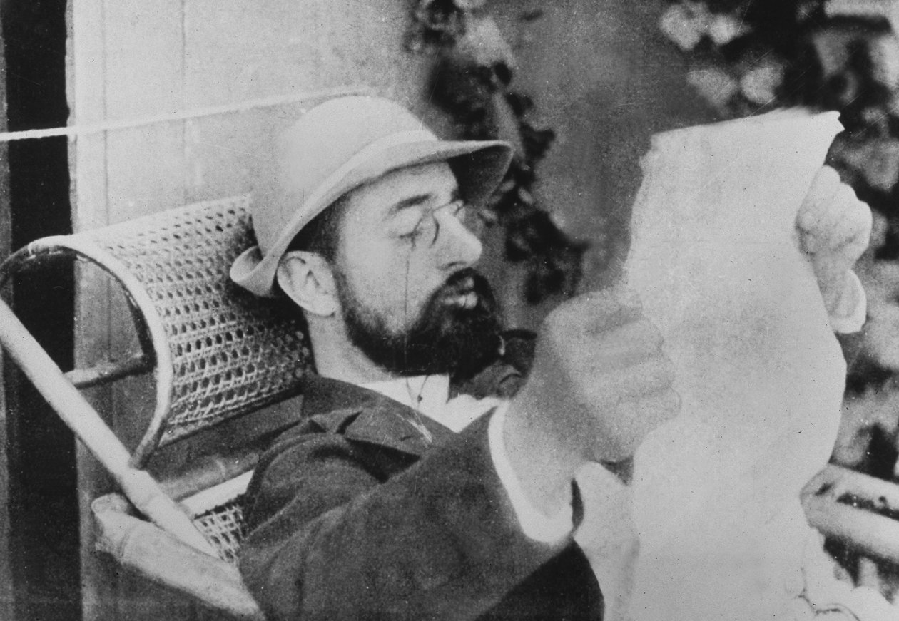 French Painter Henri De Toulouse-Lautrec Reading Paper by Unknown