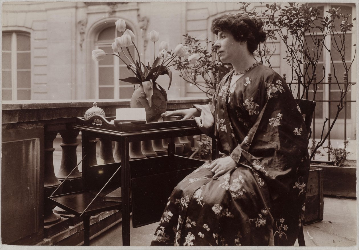 Marcelle Tinayre Sitting, a Book on a Table in Front of Her by Dornac
