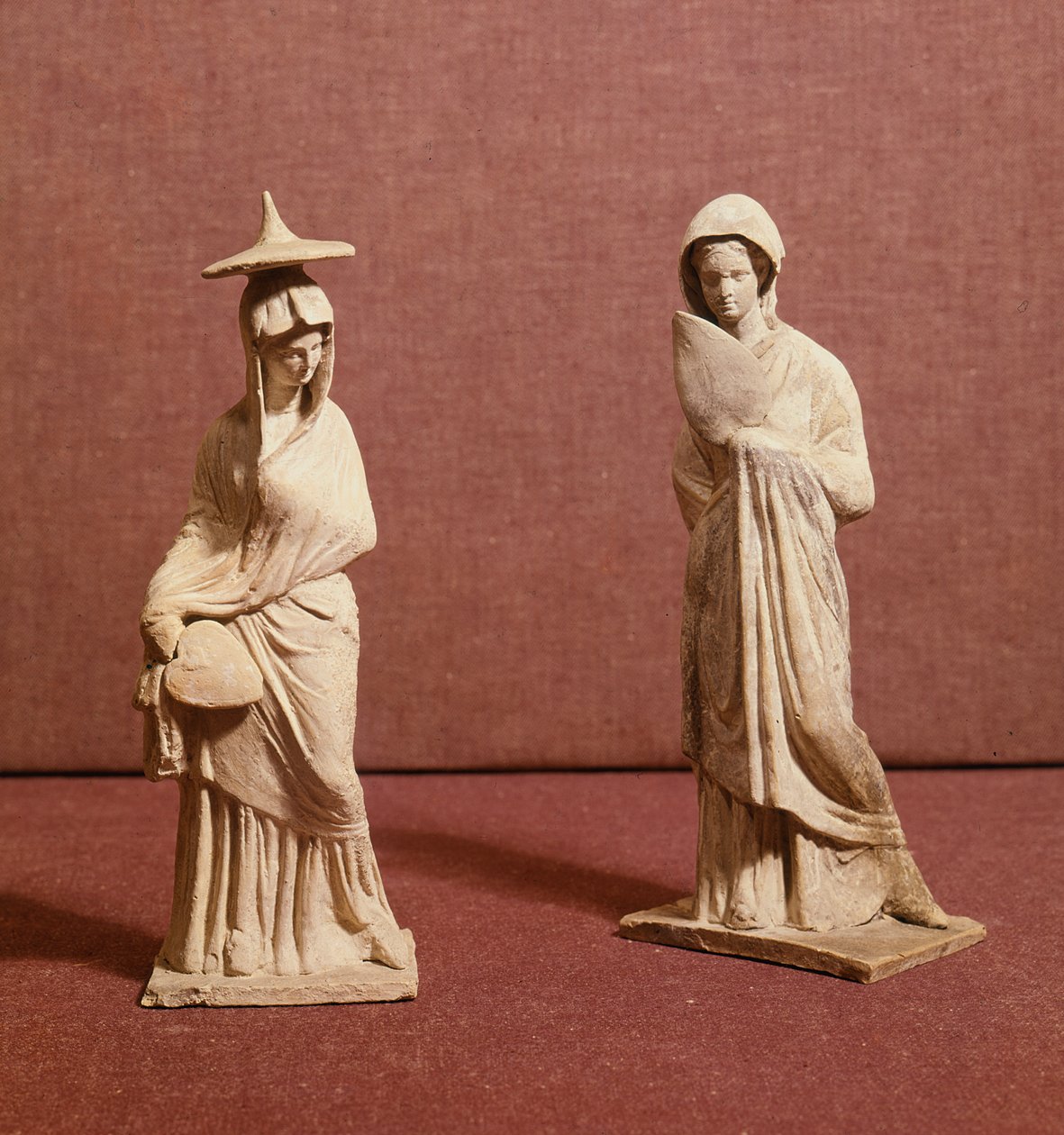 Two statues of standing women, from Tanagra by Greek School