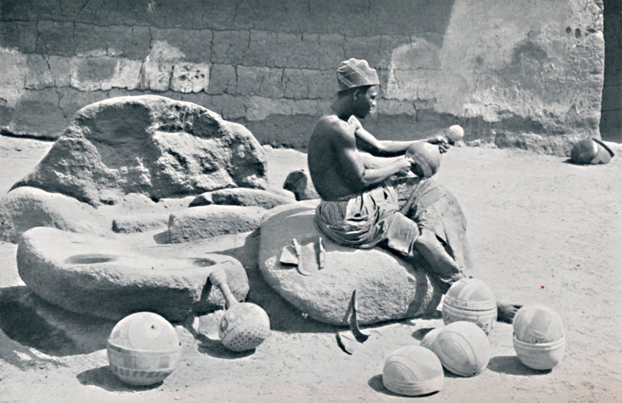 A Yoruba Man Engraving Clay Bowls and Water Jars, Lagos Hinterland, Southern Nigeria, 1912 by A. W. Gelston