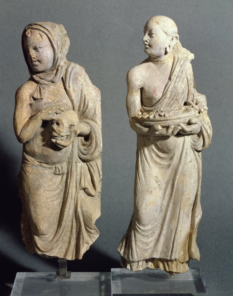 Two statuettes of standing monks, from Hadda by Afghan School