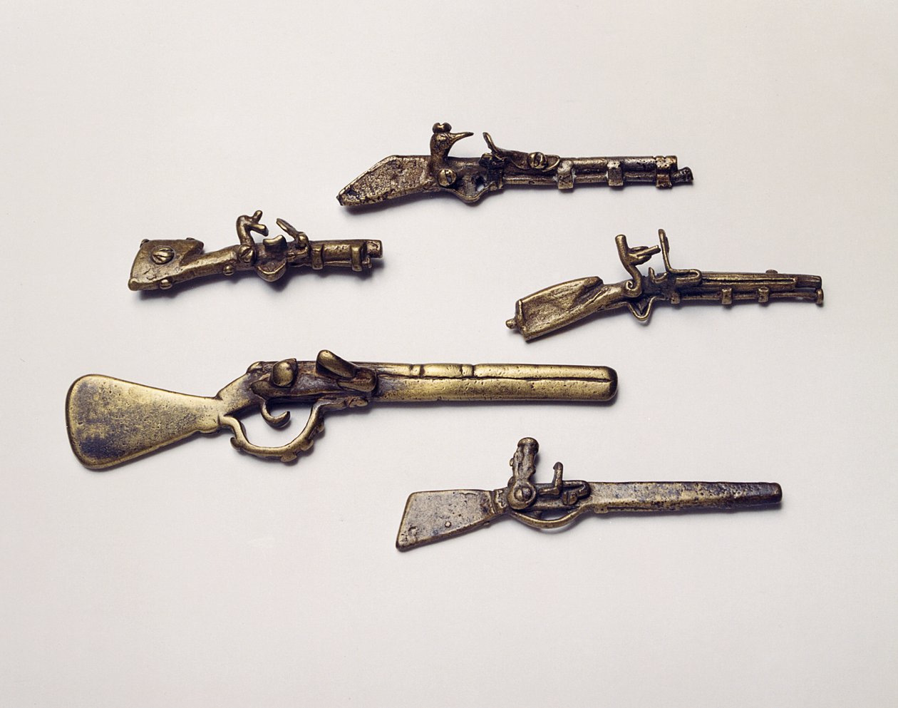 Gold weights cast in the form of guns by Akan School