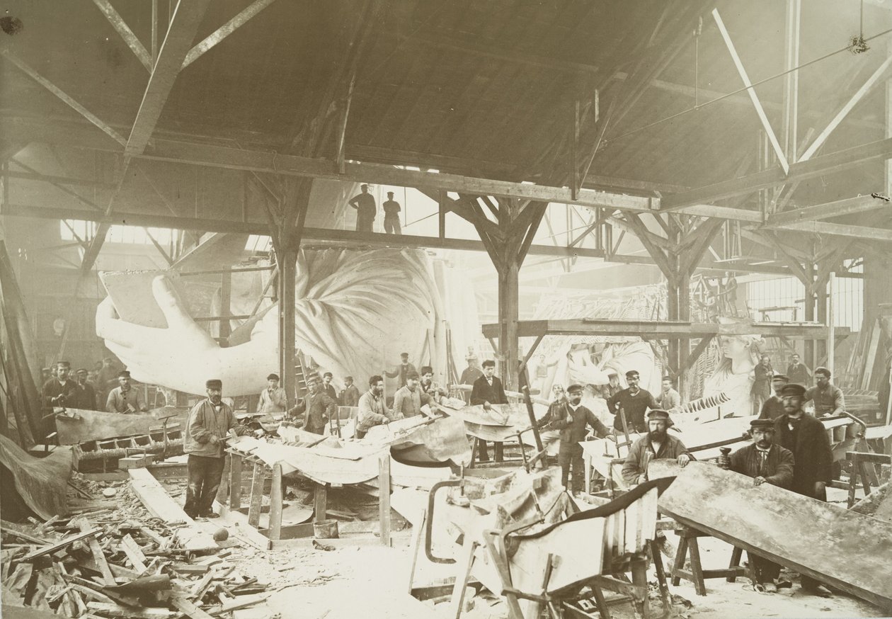 Men in a workshop hammering sheets of copper for the construction of the Statue of Liberty by Albert Fernique