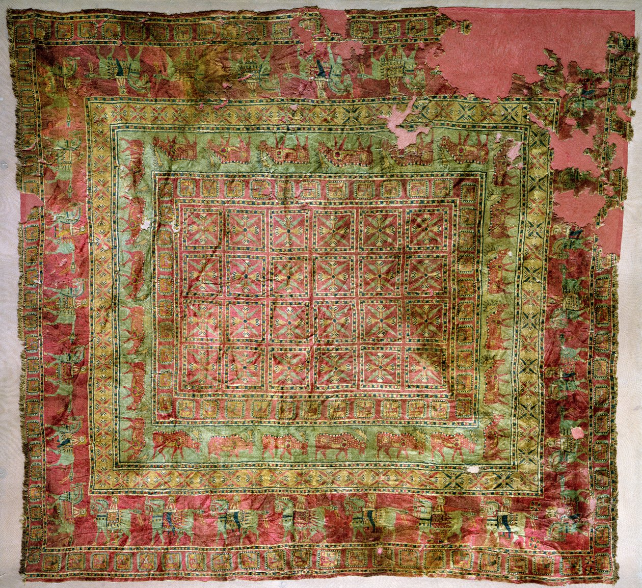 Pile Carpet depicting horses, riders, fallow deer and griffins, from Pazyryk burial mounds by Altaic School