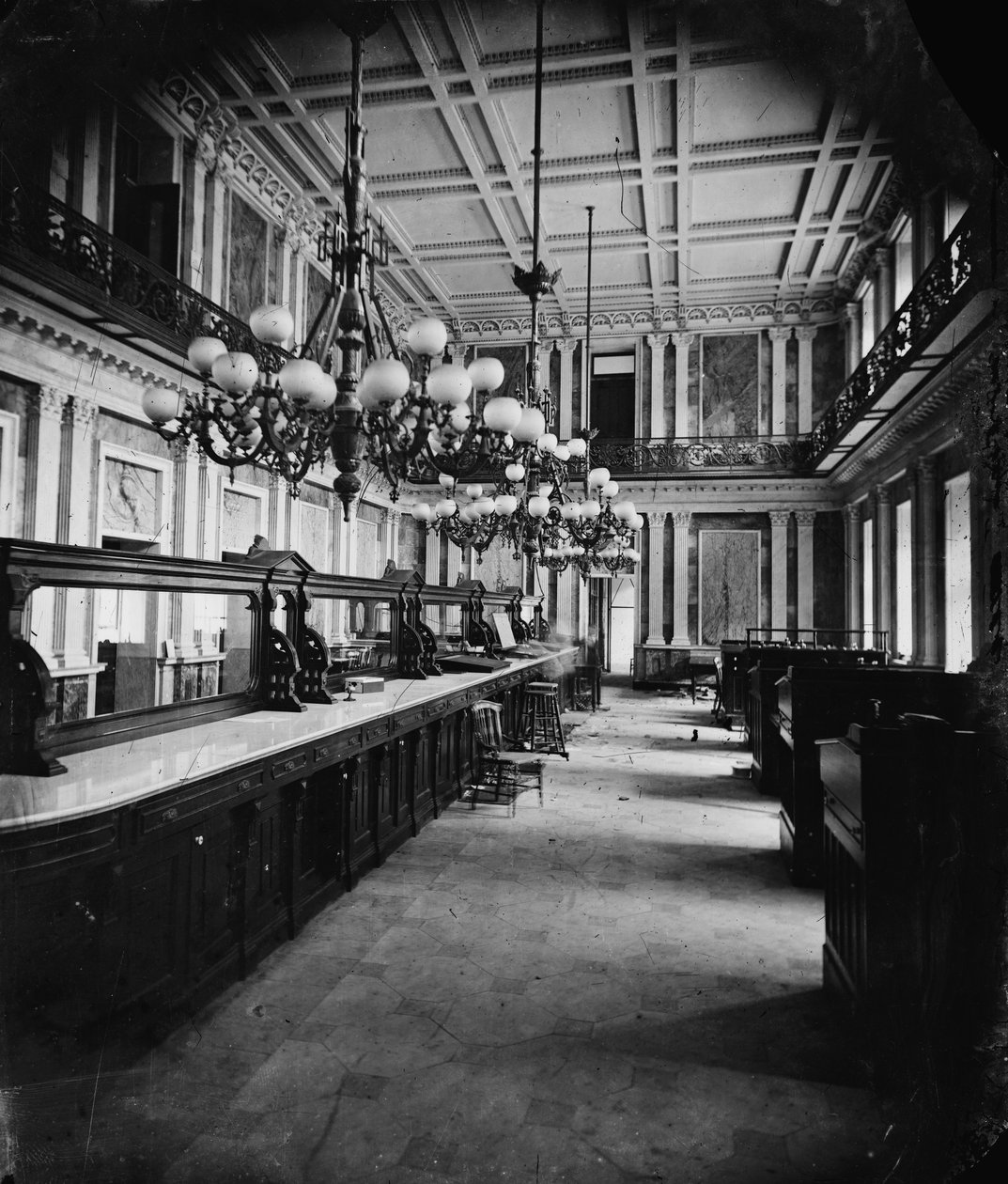 Treasury Department in Lincolns time (cash room - behind the desks), 1861-65 by American Photographer