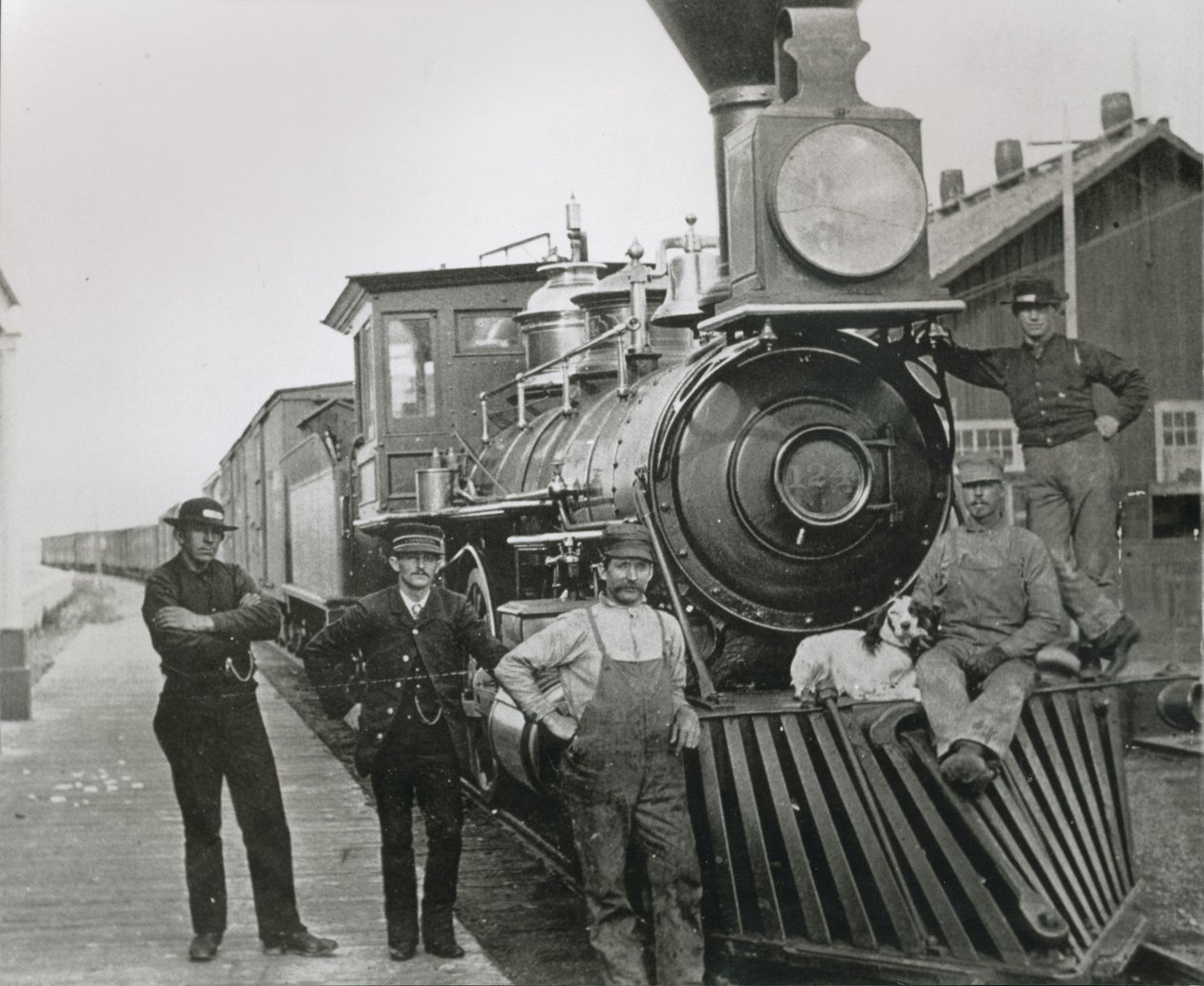 A freight train of the Central Pacific railway with crew at Mill City, Nevada by American Photographer
