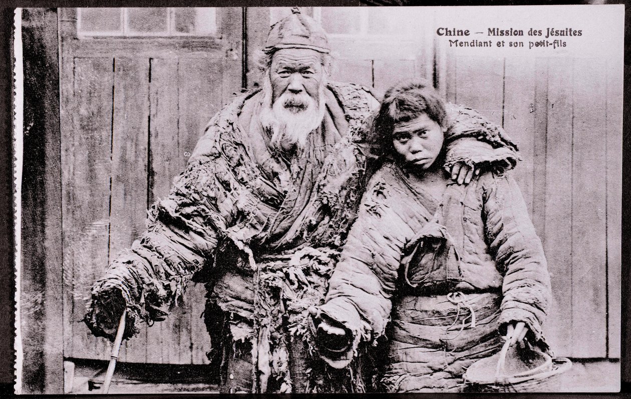 Old beggar with grandson - Early 20th century photograph - Private collection by Anonymous Anonymous