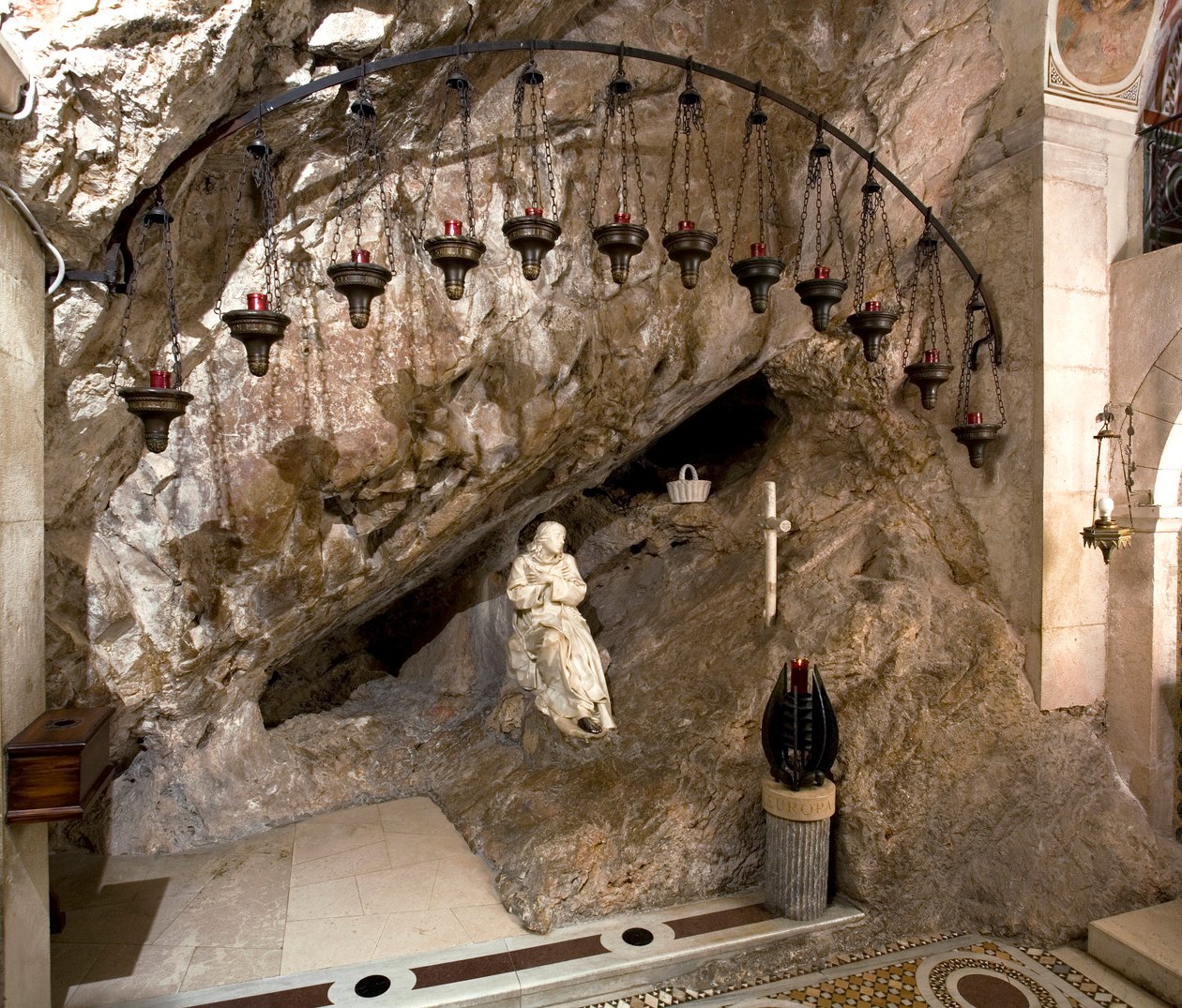 View of the cave of St. Benedetto with statue of the saint by Antonio Raggi. Monastery of Saint Benedetto, Subiaco, Italy by Antonio Raggi