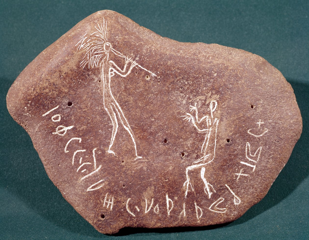 Stone inscribed with a dancer, flute player and a safaitic inscription by Arabic School