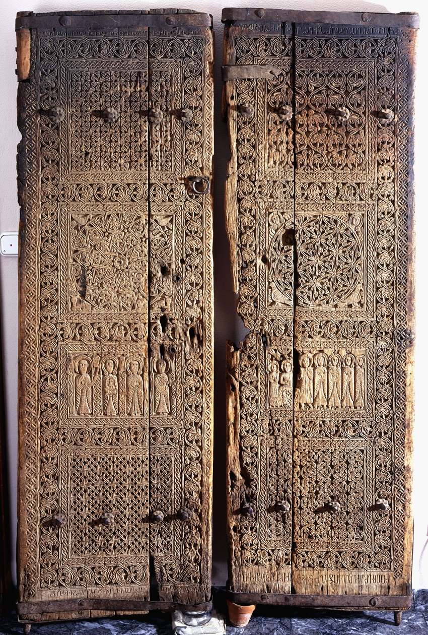 A Pair of Carved Armenian Walnut Doors, Depicting Christ with Six Apostles and Saints by Armenian School