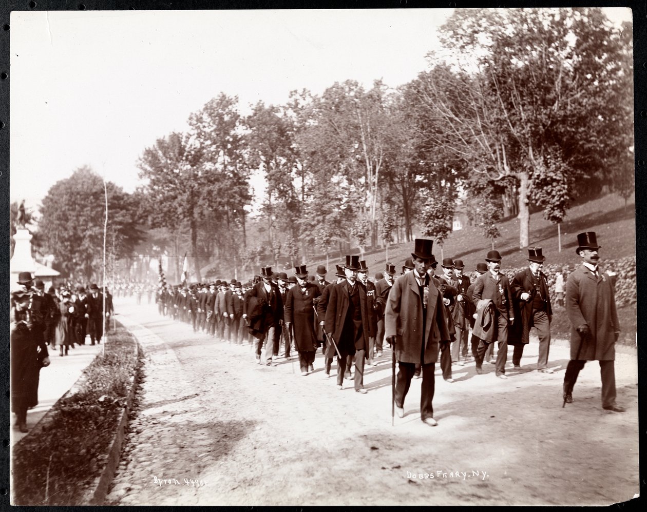 Military Parade with Uniformed Men in Top Hats in Dobbs Ferry, New York, 1898 by Byron Company