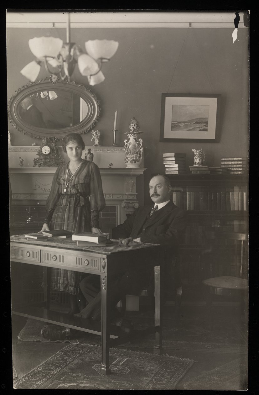 Portrait of the dentist Dr. Gibson and a woman in his residence by Byron Company