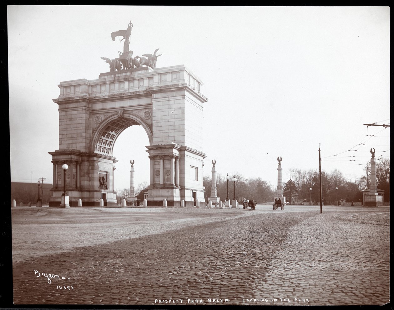 View of a Horsedrawn Carriage at an Entrance to Prospect Park, Brooklyn by Byron Company
