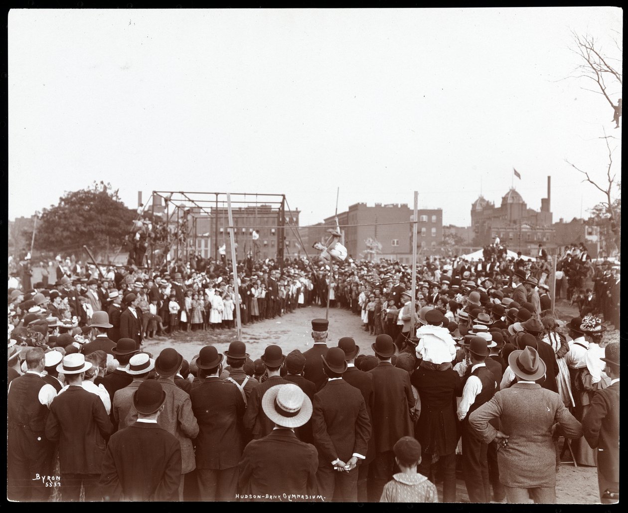 Crowd Watching a Polevaulter at the Hudson Bank Gymnasium and Playground, New York by Byron Company