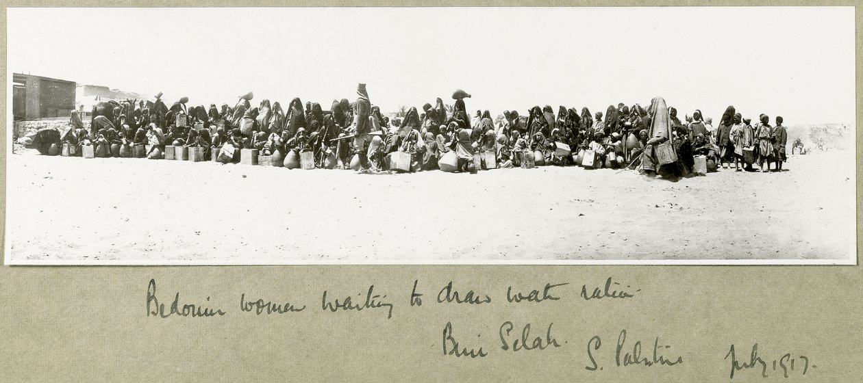 Bedouin women waiting to draw their ration of water, Beni Saleh, July 1917 by Capt. Arthur Rhodes