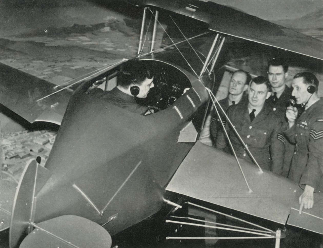 RAF personnel learning to fly in a flight simulator during the Second World War by Charles Brown