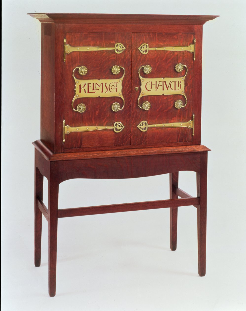 The Kelmscott Chaucer cabinet, designed by C.F.A.Voysey and made by F.Coote by Charles Francis Annesley Voysey