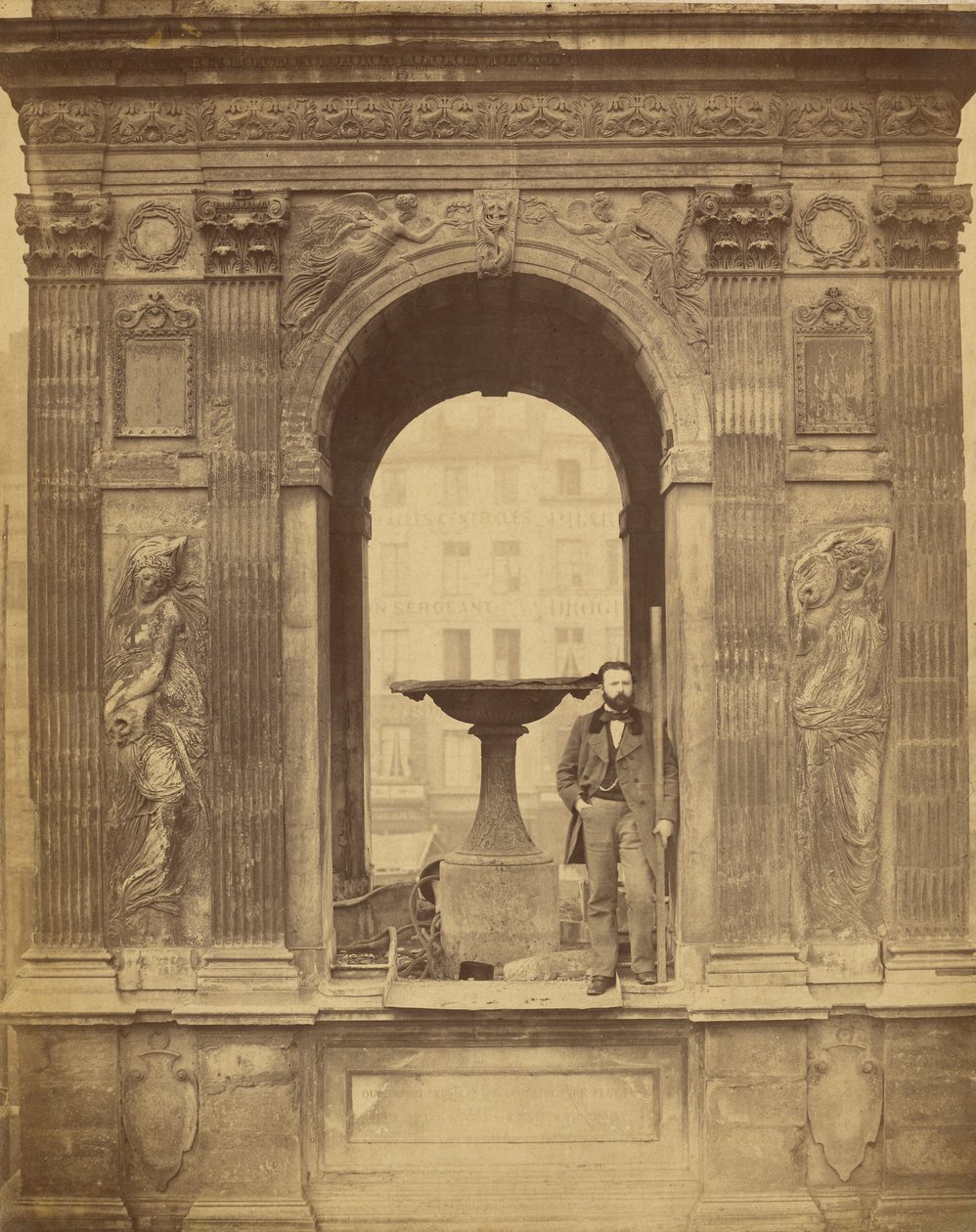 [Unidentified Man Posed in Fontaine des Innocents] by Charles Marville
