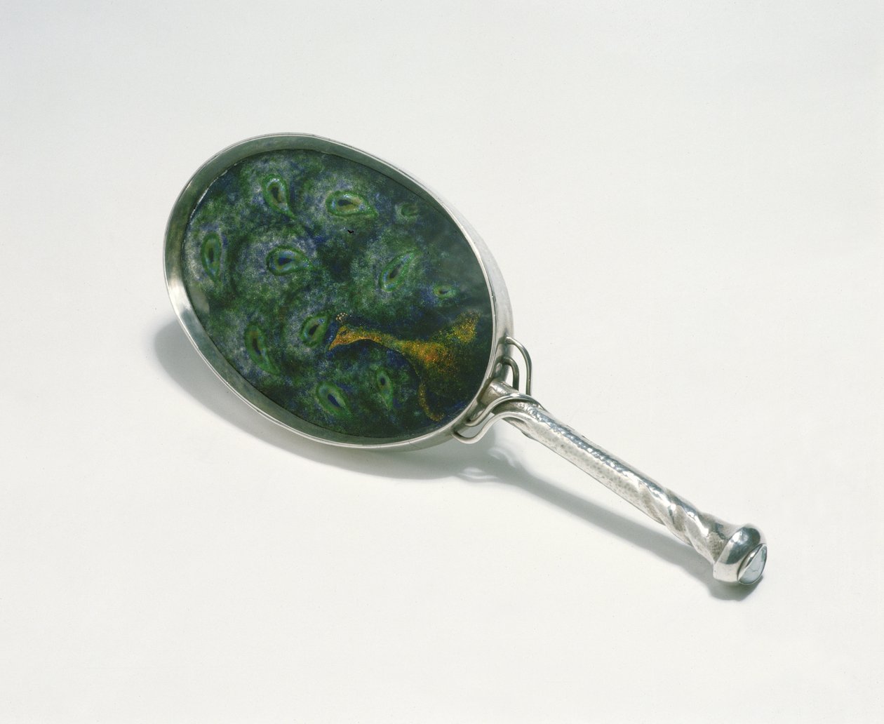 Hand mirror designed by Ashbee with peacock design enamelled by William Mark, made by the guild of Handicraft, 1903 by Charles Robert Ashbee