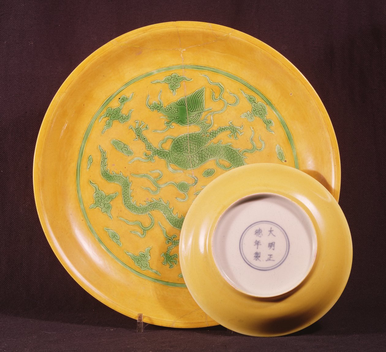 Two Imperial yellow saucer dishes, Cheng-te period (1506-21) by Chinese School