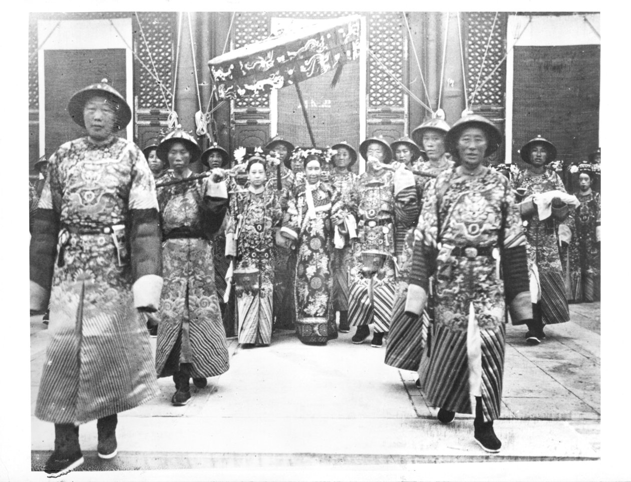 Portrait of TzU-Hsi (1835-1908) Empress Dowager of China with ladies-in-waiting and guards by Chinese School