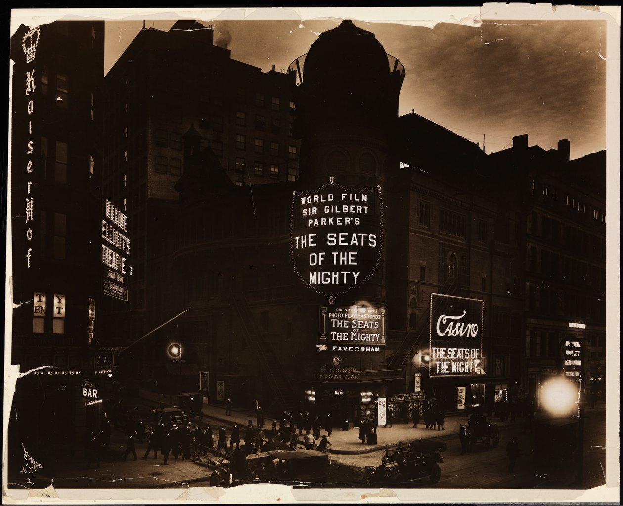 The Casino Theatre at night, crowds and cars, and construction workers digging in street, Broadway and 39th St., New York, c.1915 by Company Byron