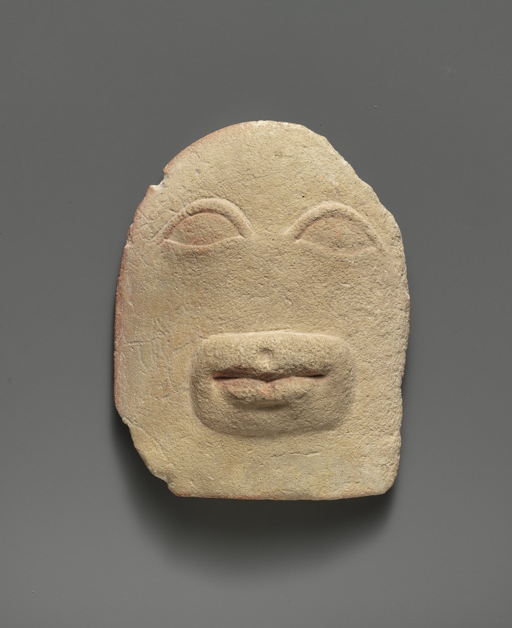 Limestone votive relief of eyes and a mouth (limestone) by Cypriot School