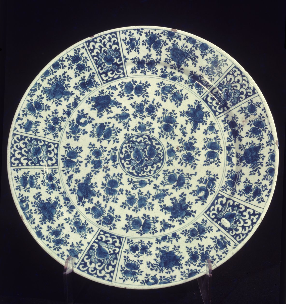Plate with blue rose pattern by Dutch School