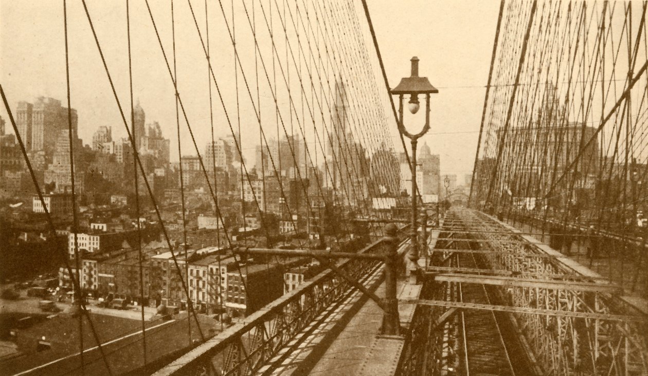 Lower Manhattan Viewed Through The Network Of Cables On Brooklyn Suspension Bridge, c1930 by ENA
