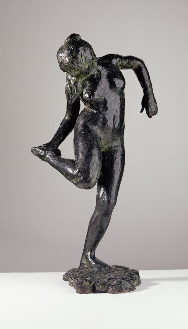 Dancer looking at the sole of her right foot by Edgar Degas