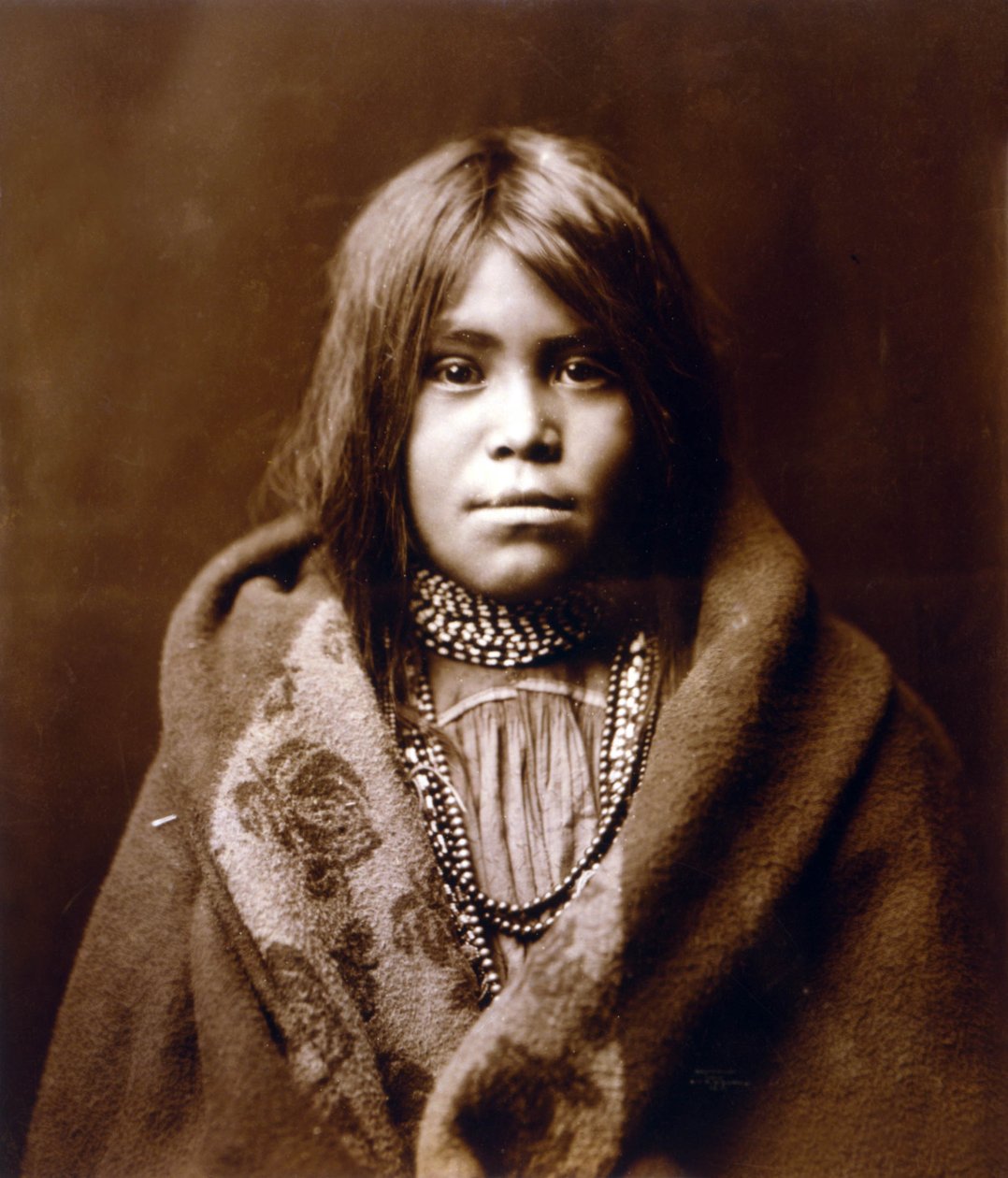 An Apache girl, photo Edward S. Curtis by Edward Sheriff Curtis
