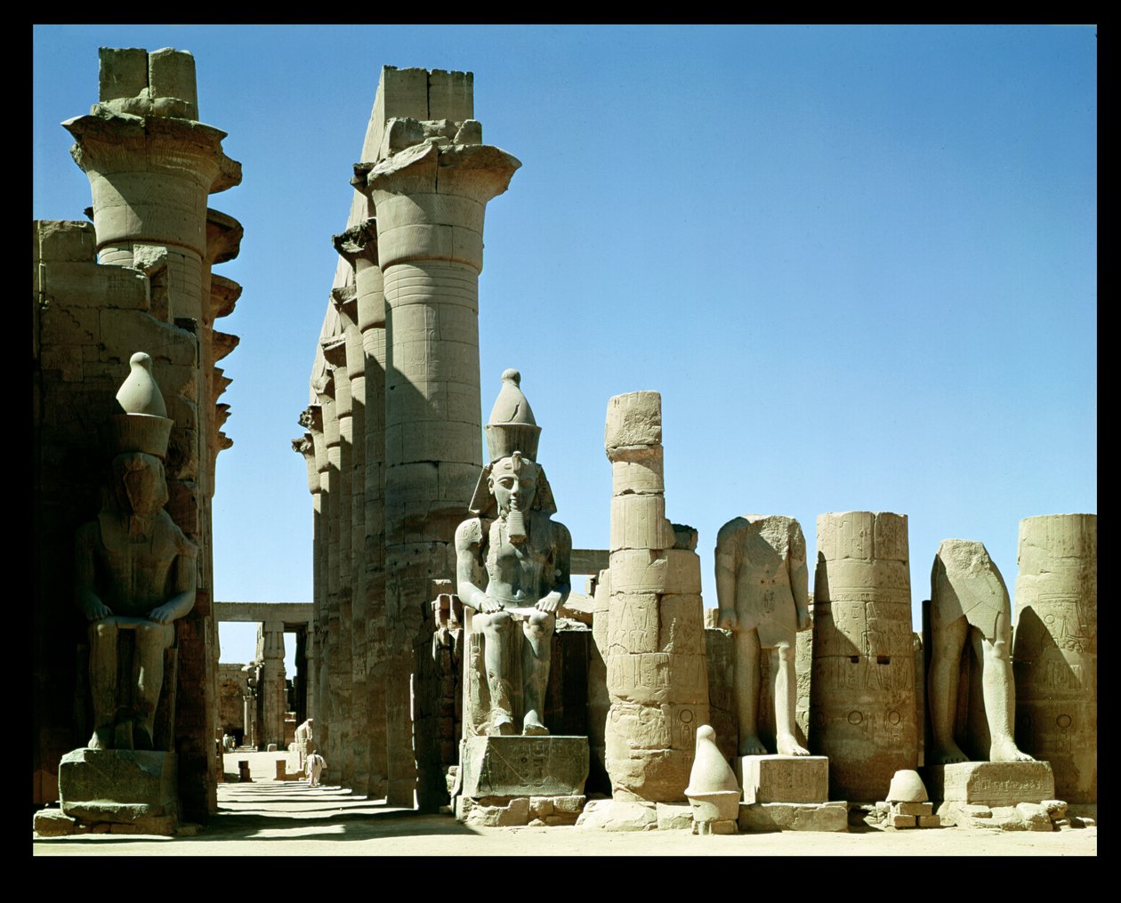 Colosses of Ramesses II and the Pylon of Amenophis III, in the Peristyle Court by Egyptian 19th Dynasty