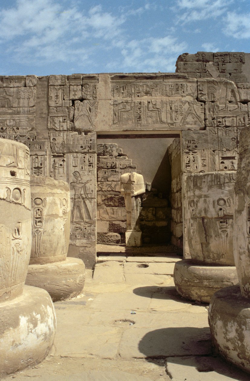 Statue of Ramesses in a chapel leading from the Hypostyle Hall of the Mortuary Temple of Ramesses III by Egyptian 20th Dynasty